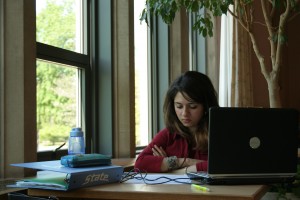 MSU student with laptop studies in the MSU Union