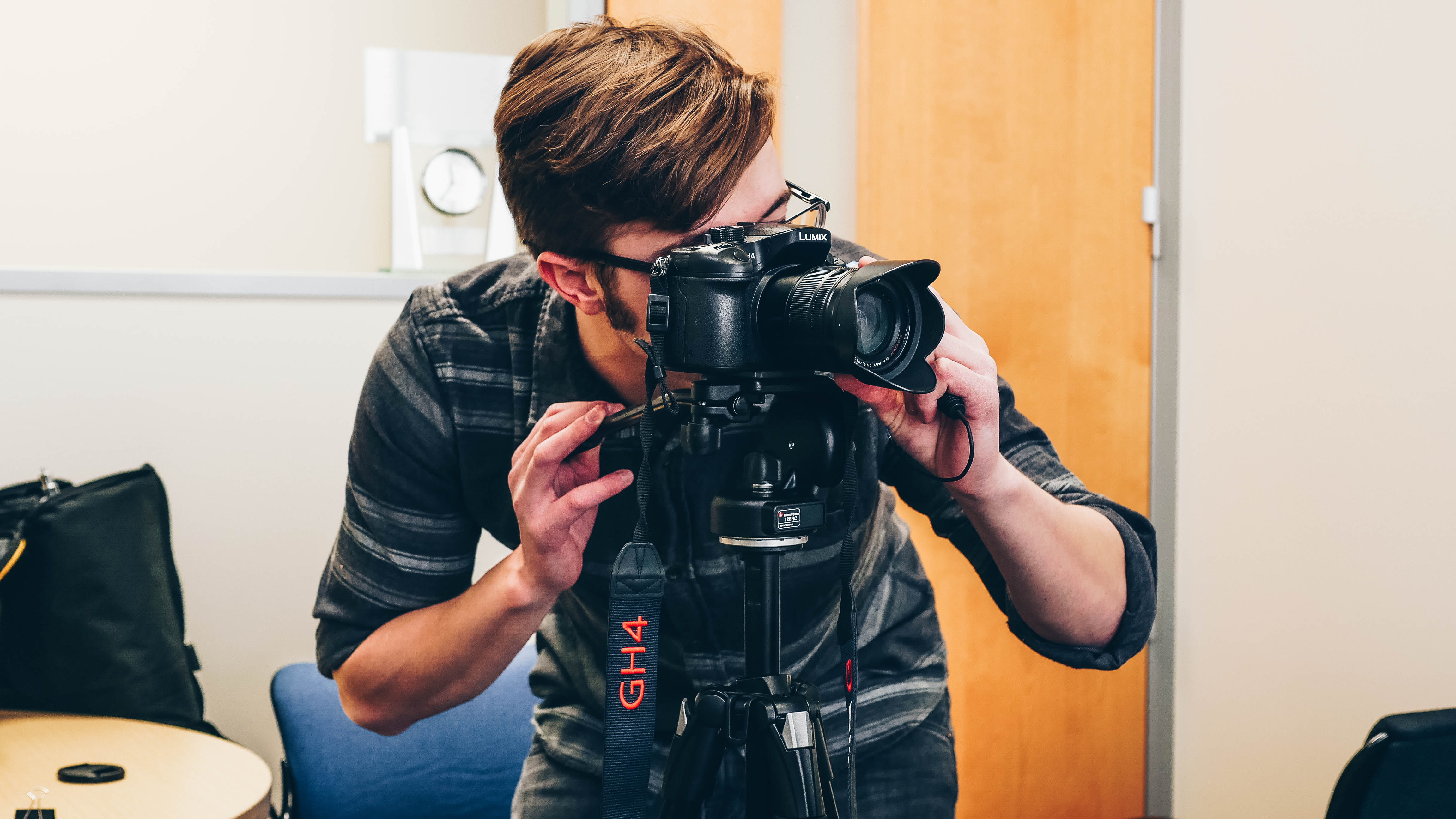An MSU IT student employee with a video camera supporting the video production service