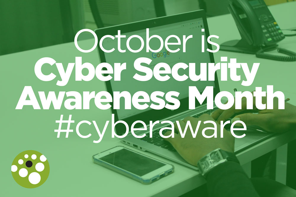 Hands on computer. Octber is Cyber Security Awareness Month